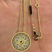 With diamond and gold necklace